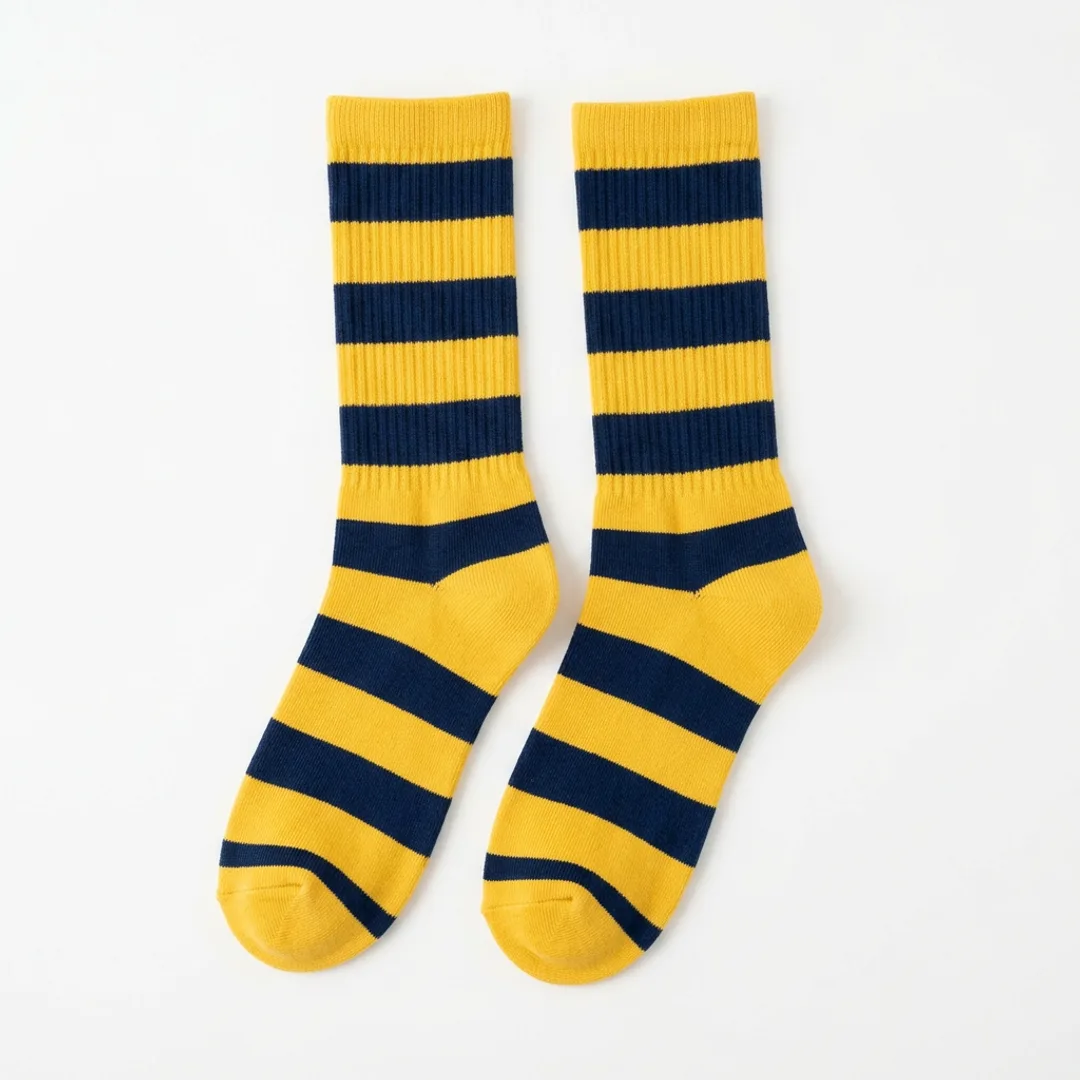 Maize and navy varsity stripe crew socks flat lay